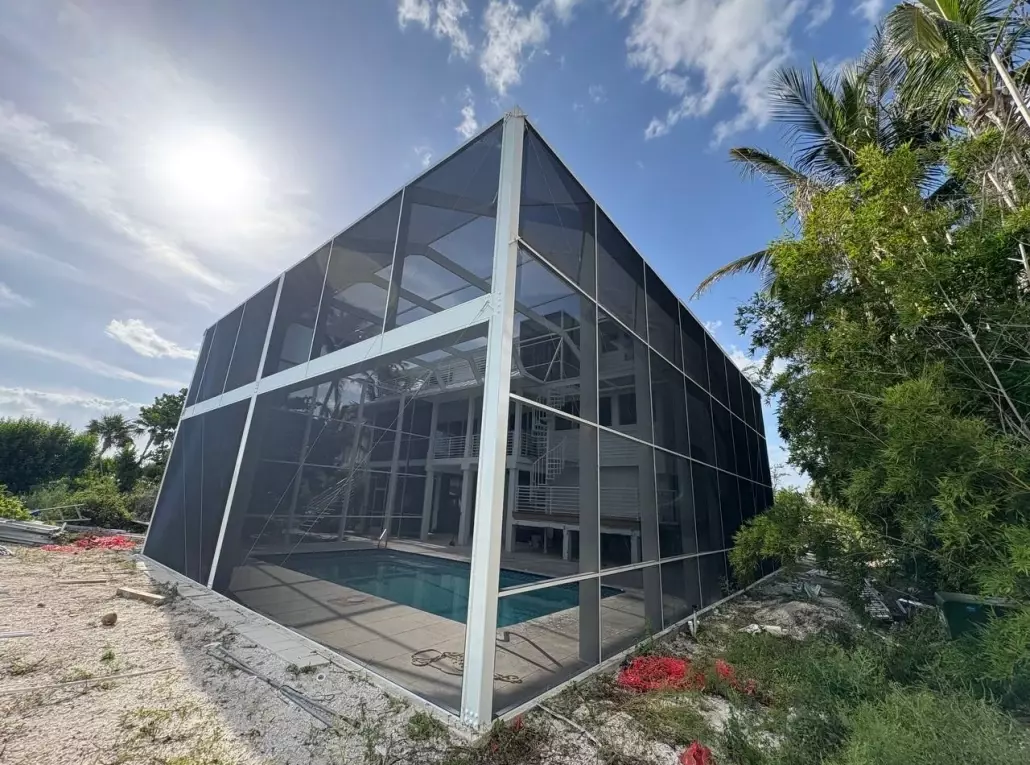 This project in Sanibel shows how a pool enclosure can completely transform an outdoor area after hurricane damage.