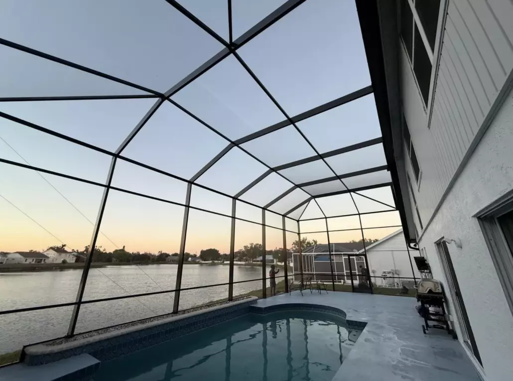 Before and After: seamless two-story pool enclosure installation in Bradenton