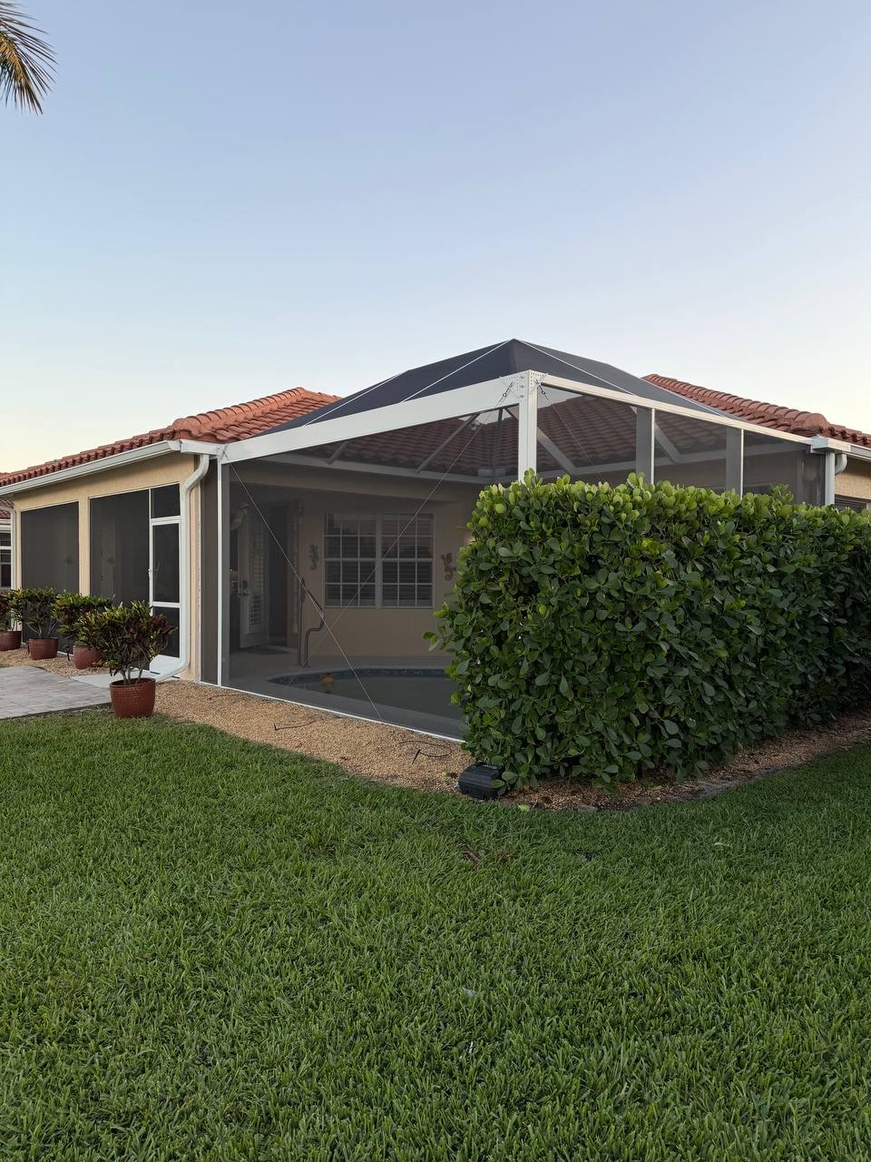 Completed pool screen enclosure with landscaping Fort-myers Florida