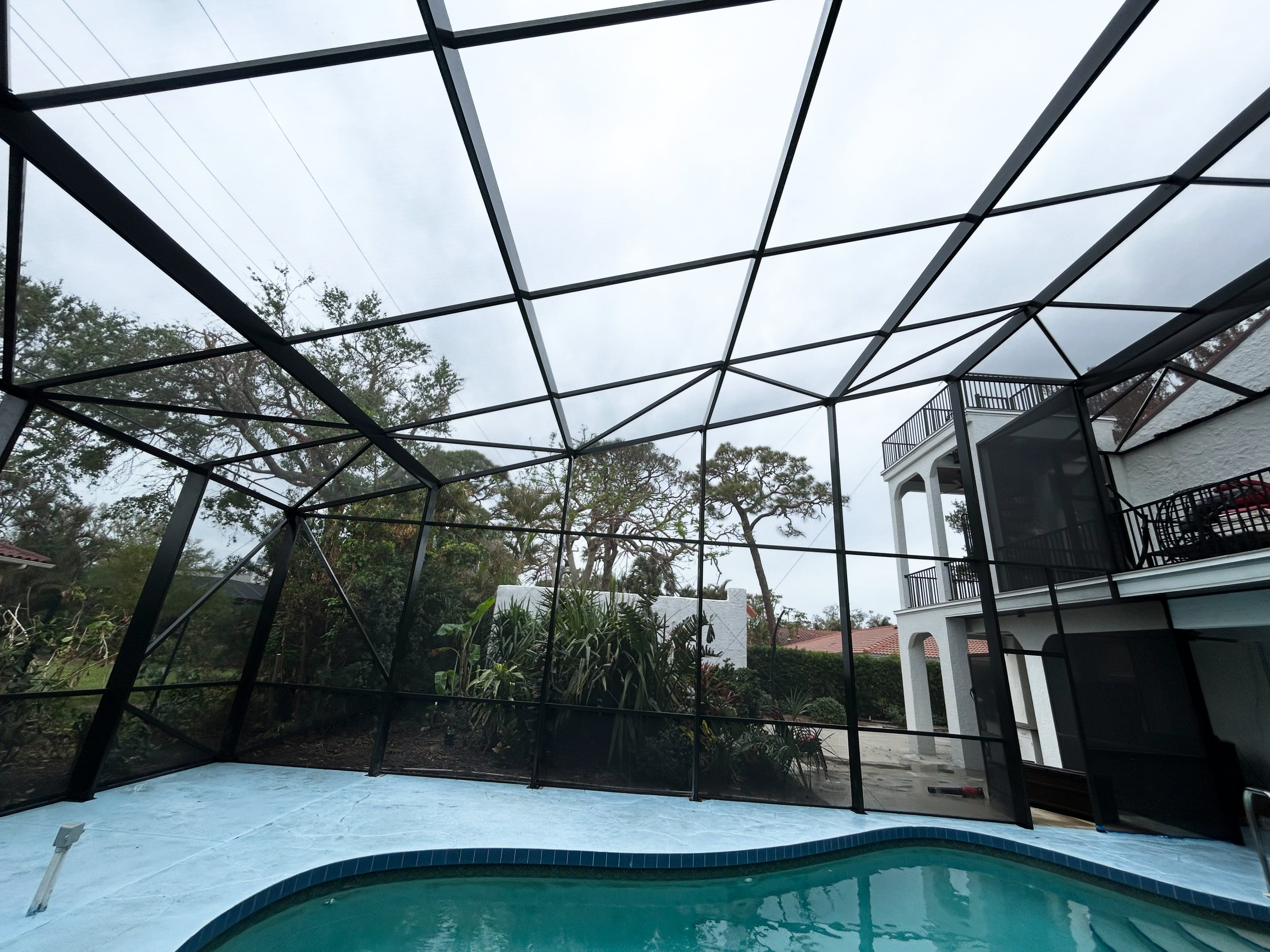 Two story pool enclosure interior view Venice FL