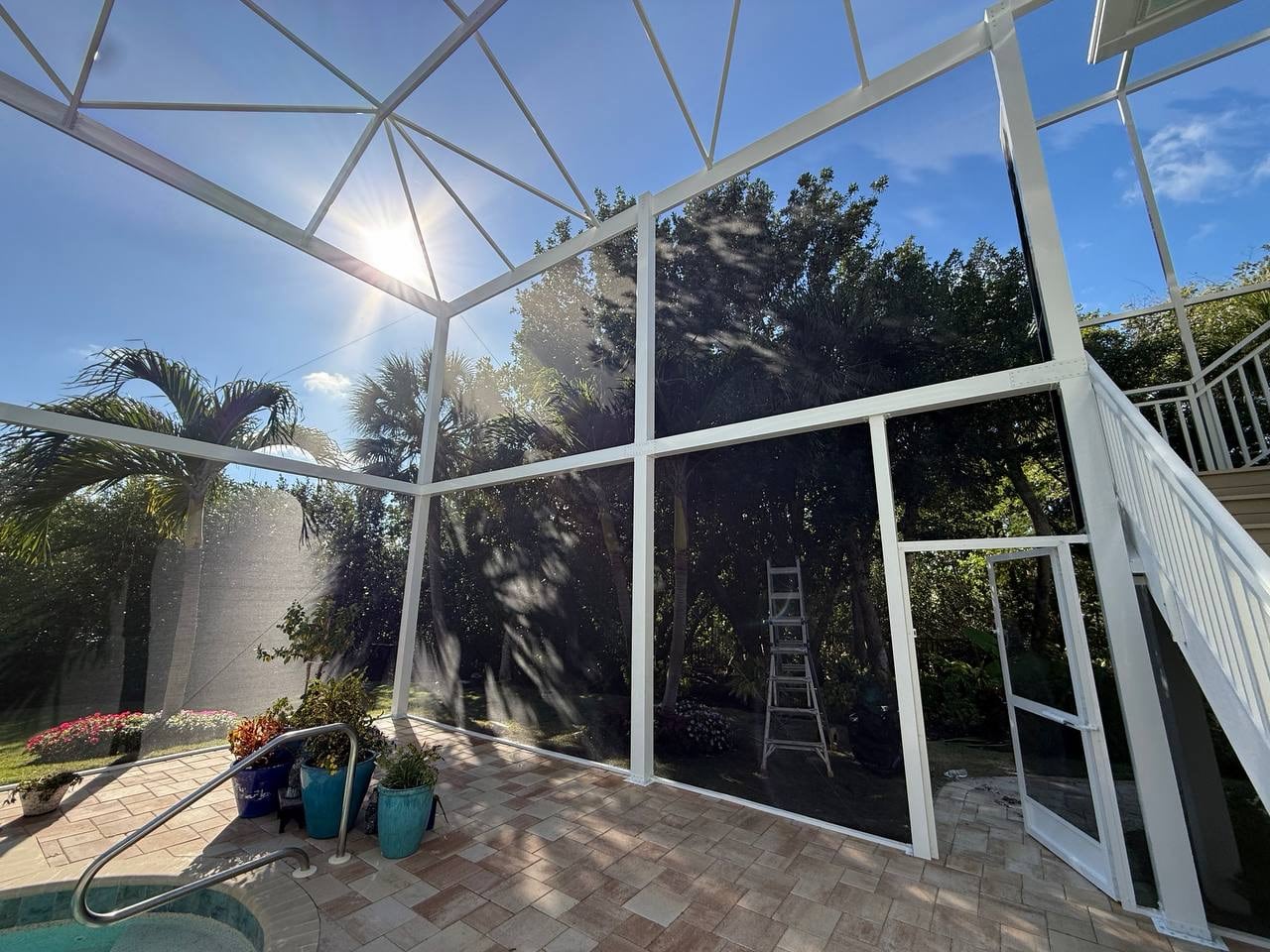 Finished pool enclosure with clear views of the Florida landscape