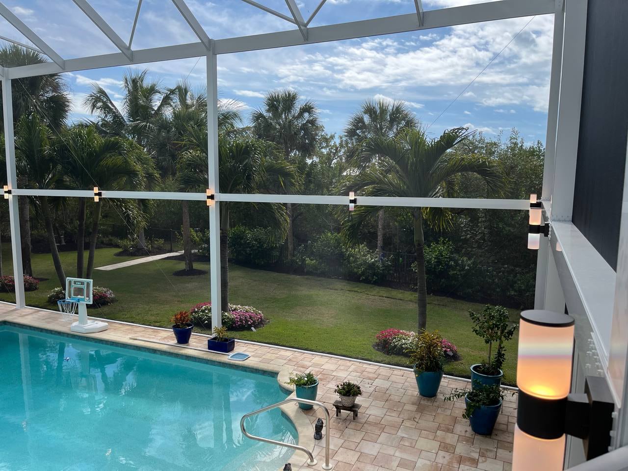 Pool area lighting inside the panoramic screen enclosure