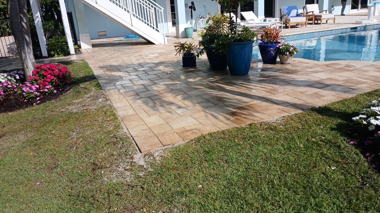 Completed paver deck surrounding the residential swimming pool