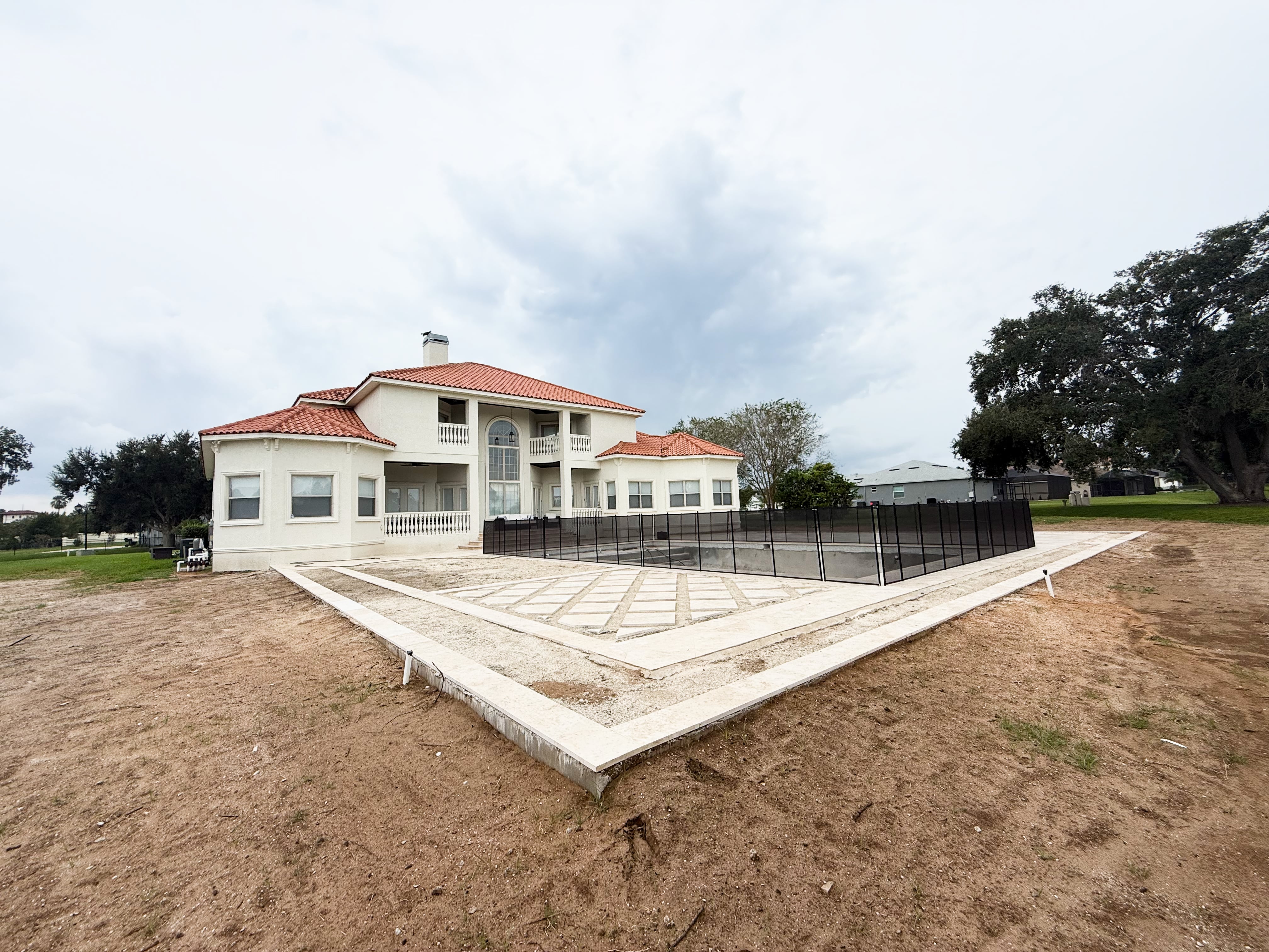 Backyard pool deck before enclosure