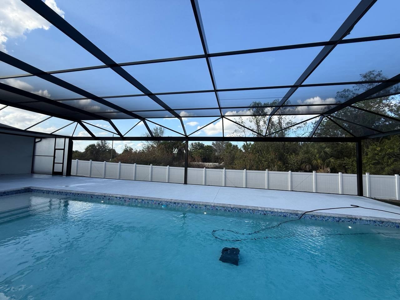 Swimming pool under screen enclosure