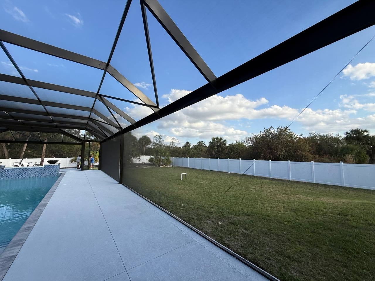 Unobstructed backyard view from pool cage
