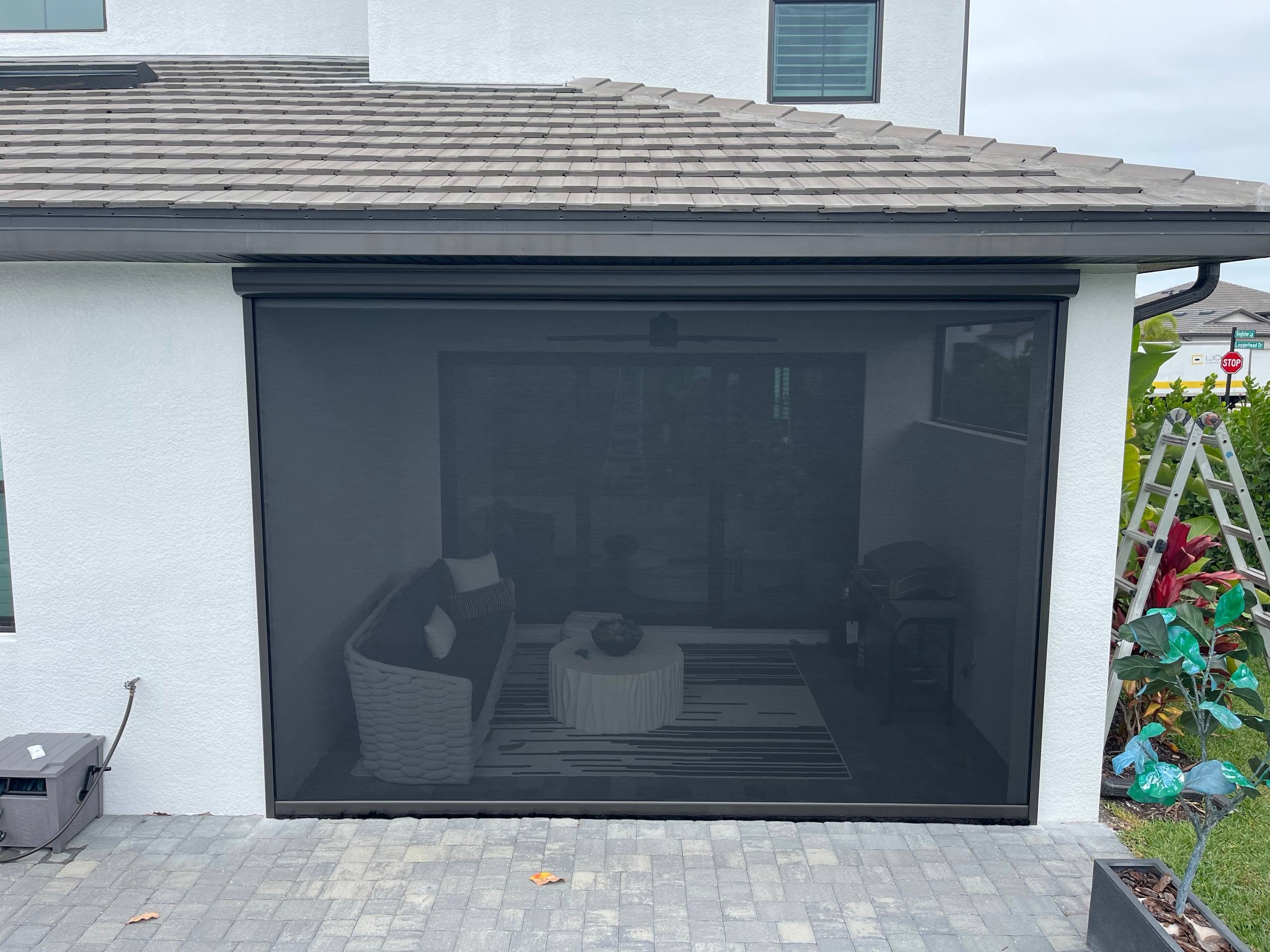 Patio after motorized screen installation Naples