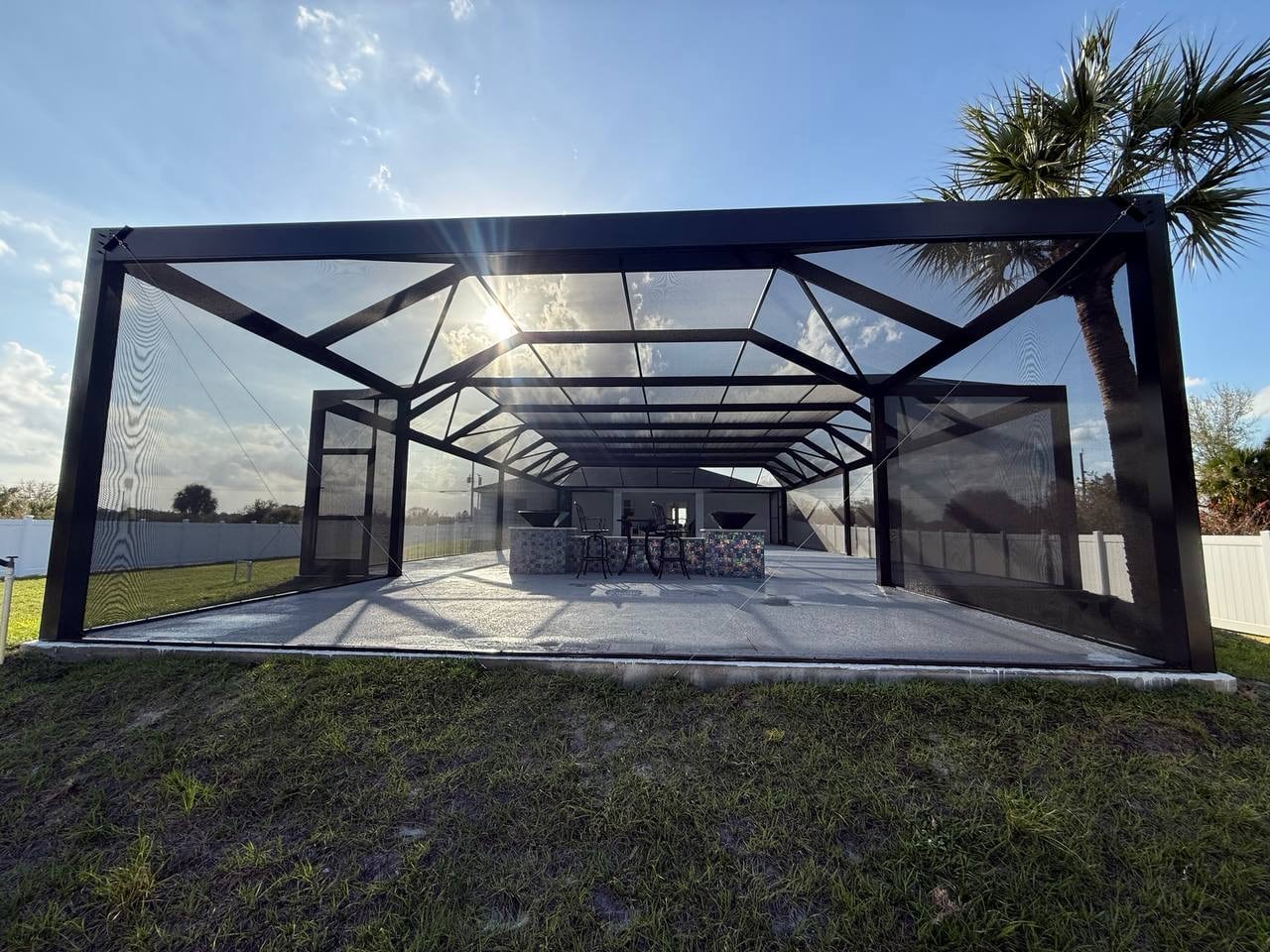 Large backyard pool enclosure rear view